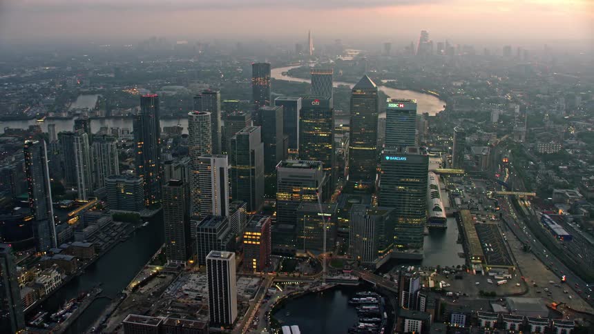 Aerial view of skyscrapers and office buildings near river thames in city of london