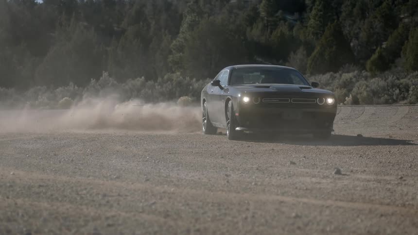 A car is doing doughnuts on a field