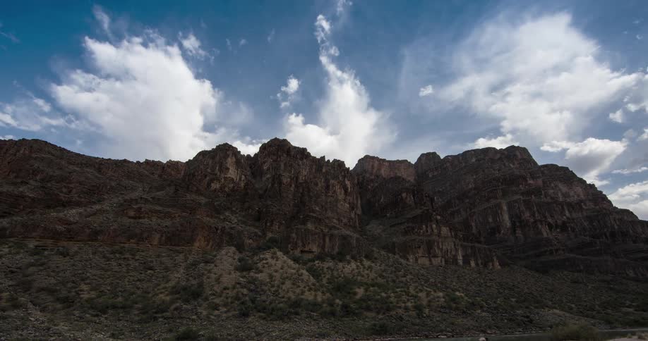 Cumulus clouds move over the superstition mountains