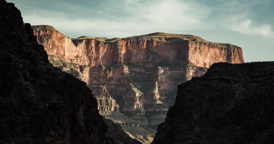 A time lapse of clouds over a canyon