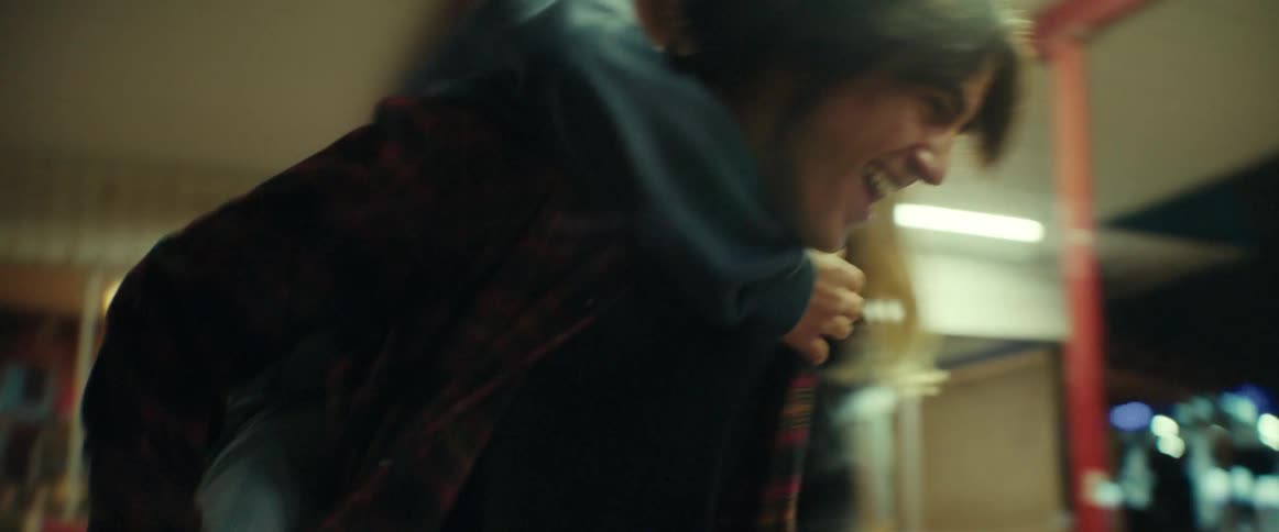 A group of young people running around at night