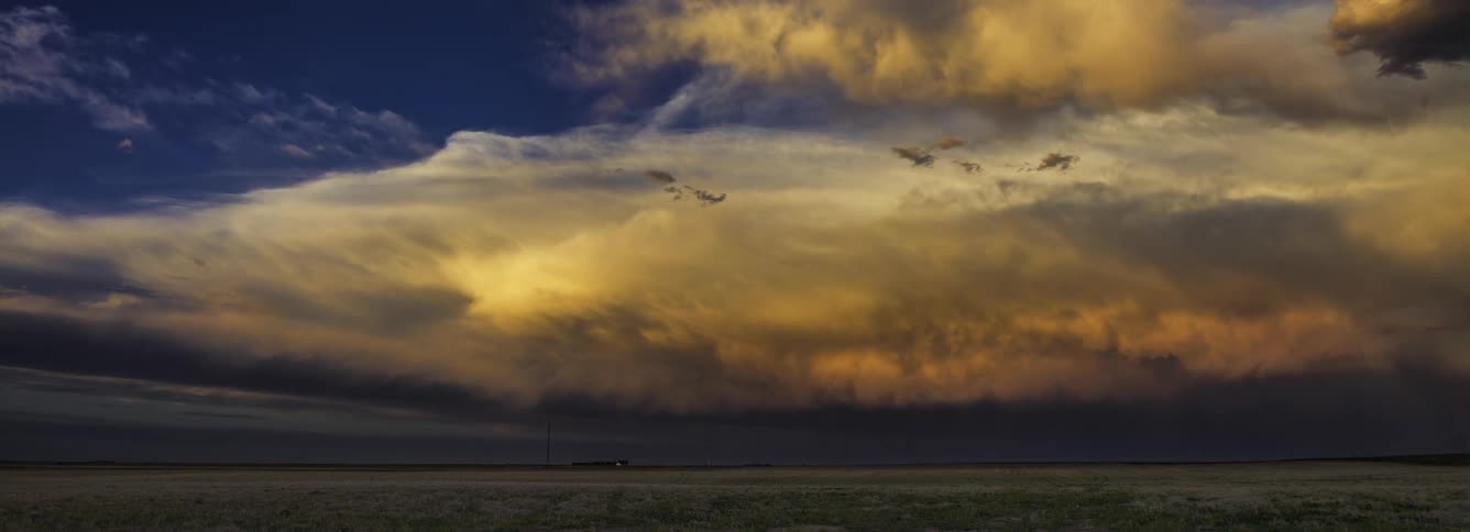 Time lapse of dark storm thunderstorm clouds rolling over the countryside at daytime