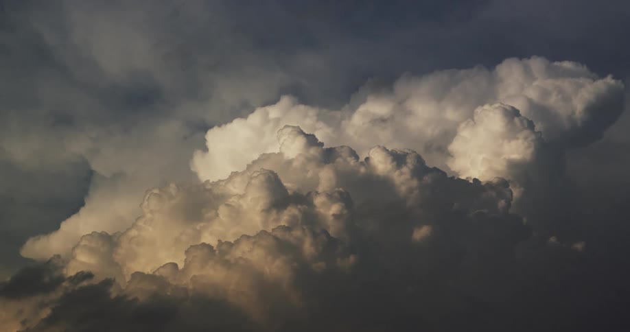 Cumulus clouds are moving in the air as the sky grows darker
