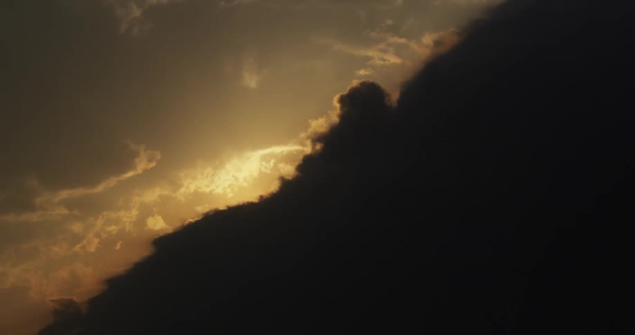 Time lapse of clouds forming in the sky and beginning to cover the sun