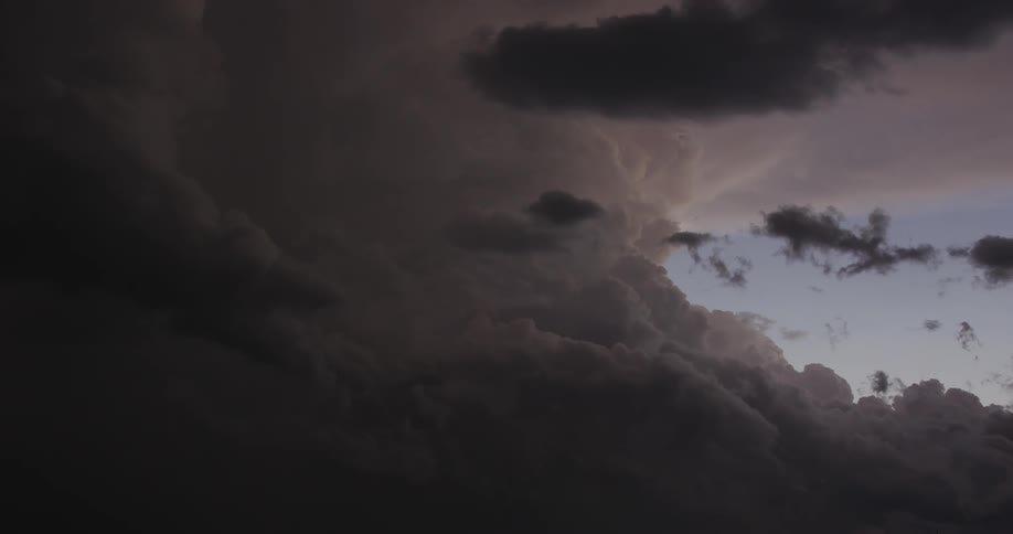 Dark storm clouds float across the sky