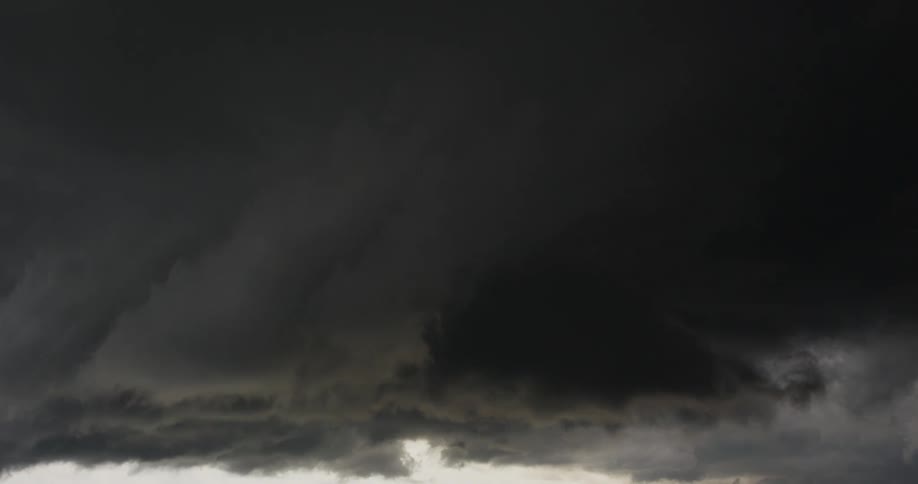 A dark group of clouds swirls around slowly in the sky as if a storm is coming