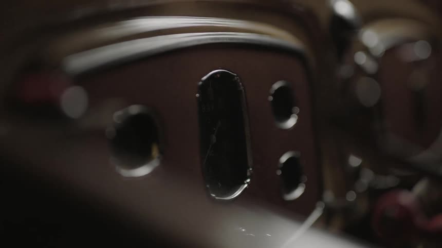 A vehicle has many dials and a wheel