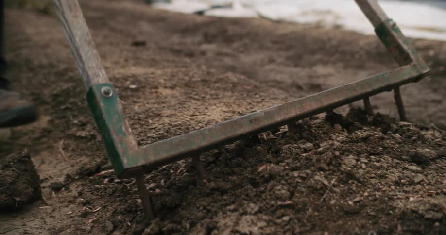 Farmer demonstrates a broadfork