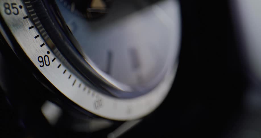 A view of a gauge with metal and glass