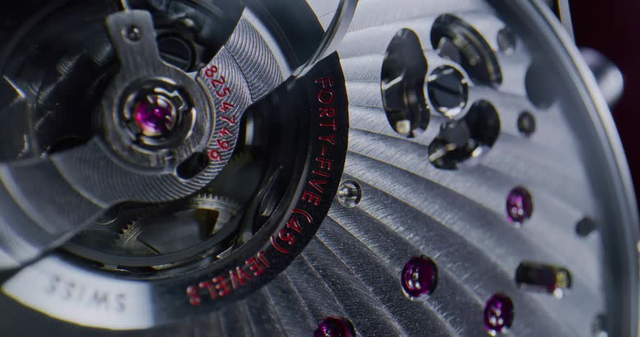 Close up of the spinning gears of a luxury wristwatch chronometer