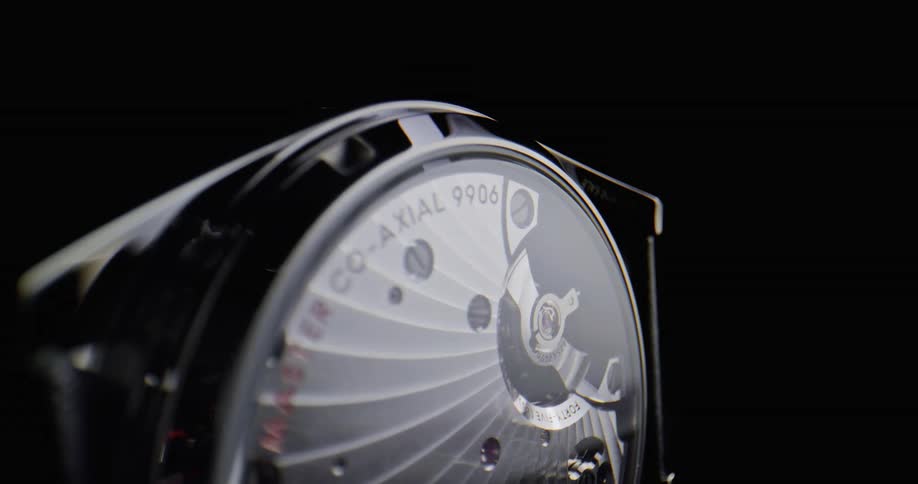 Close up of the spinning gears of a luxury wristwatch chronometer