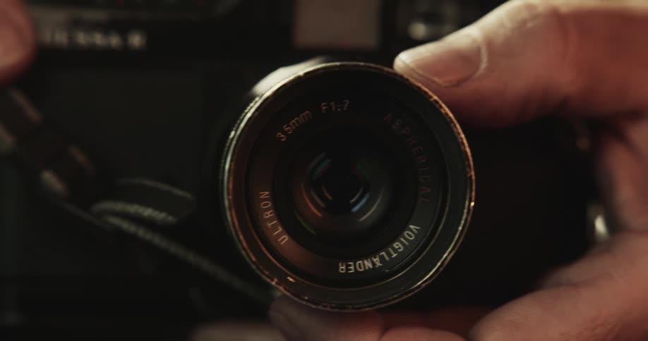 Closeup of photographer taking photo with camera
