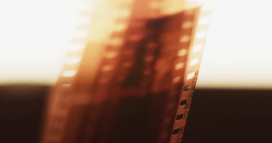 Light shines on strips of camera film