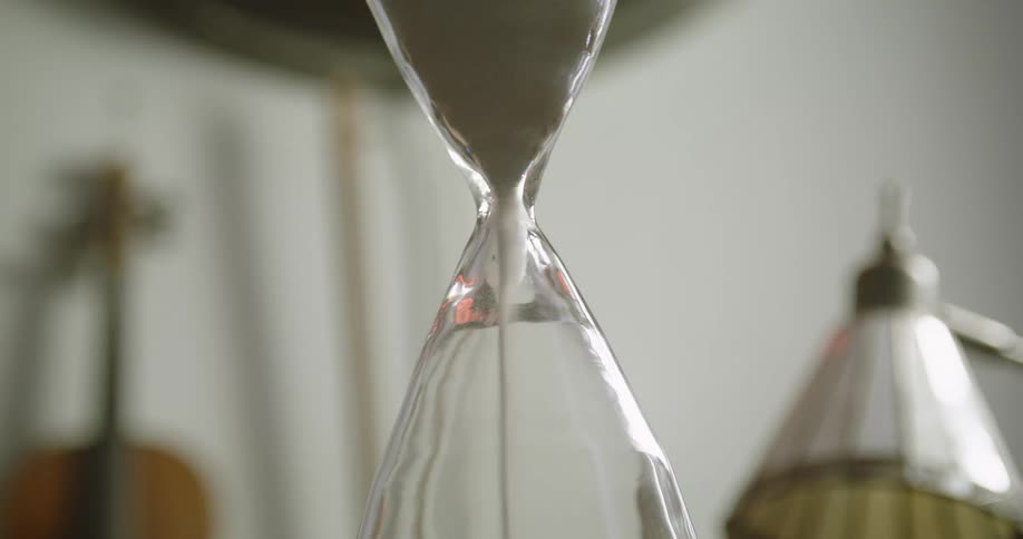 Man puts down hourglass
