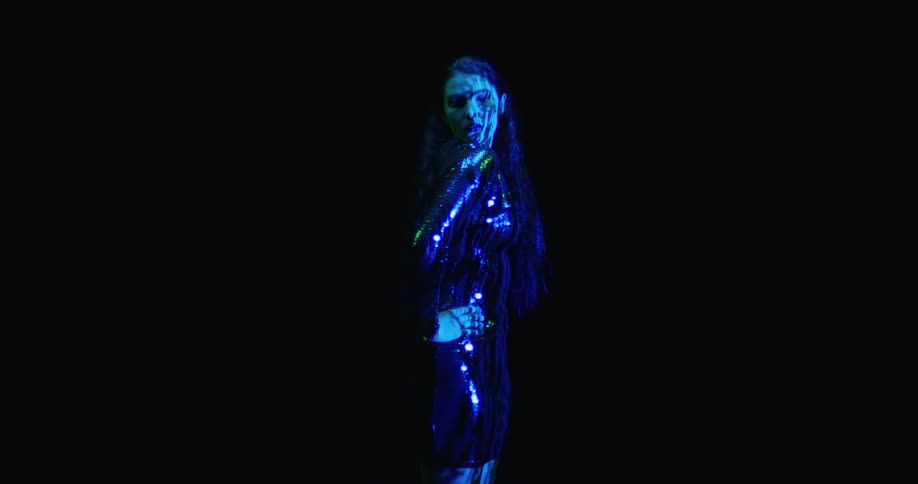 A portrait of a woman on stage