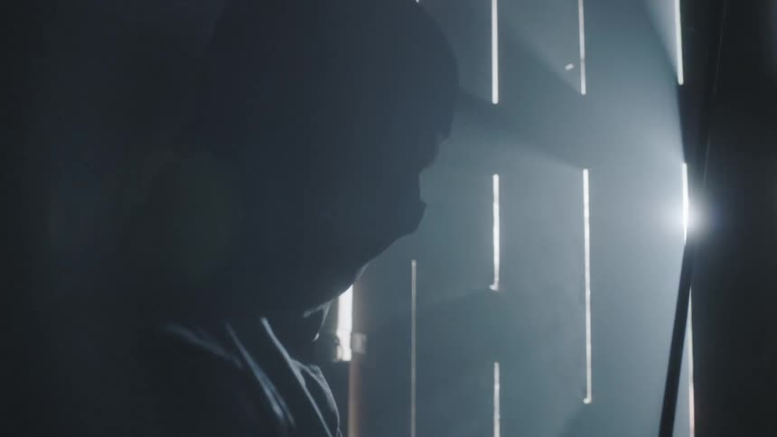 A man wearing a mask is holding a sword