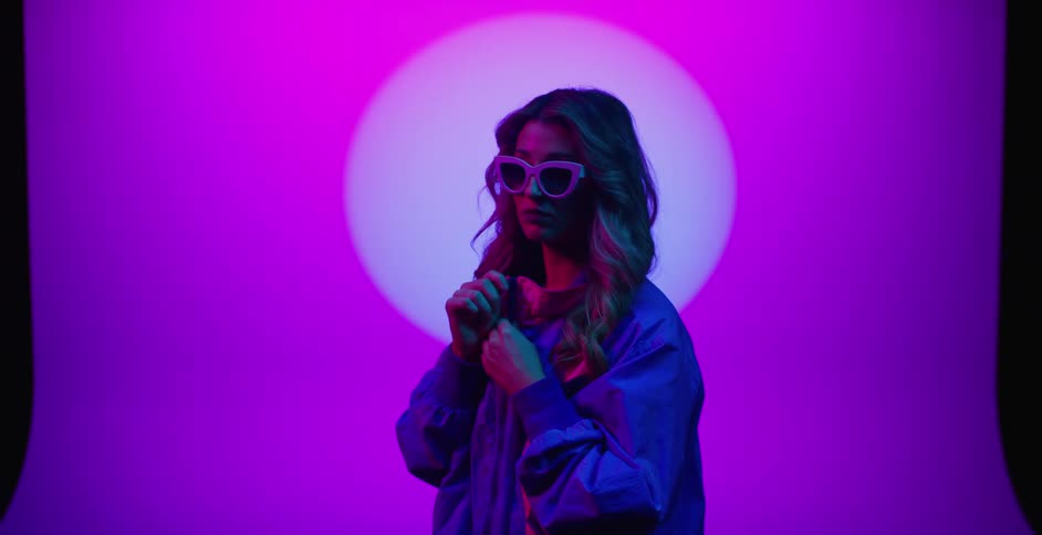 A portrait of a model wearing sunglasses is displayed