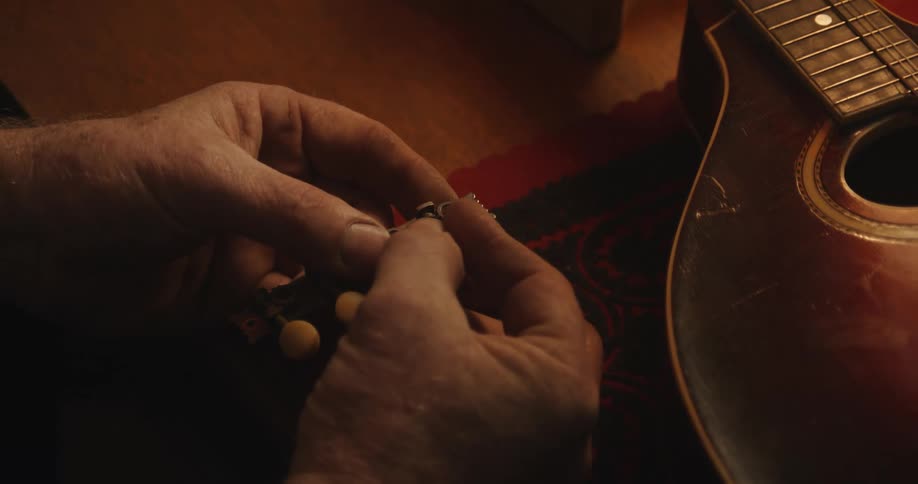 A person is repairing a violin