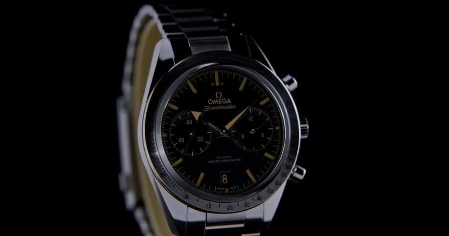A studio product shot of a wristwatch with a dark background