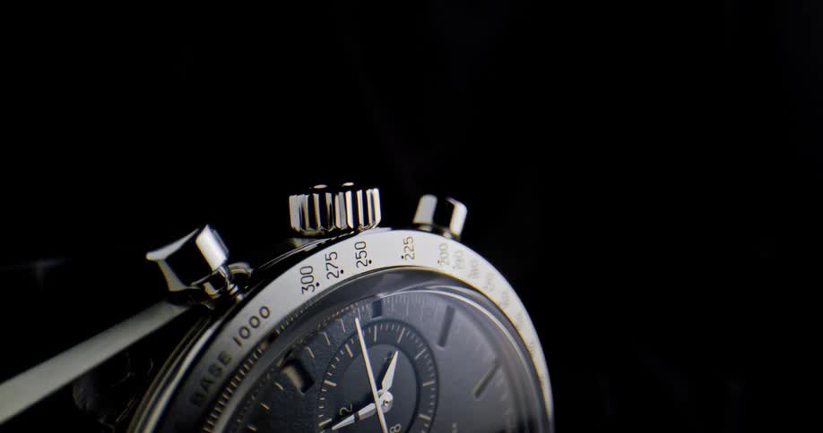 Close up of clock arms moving on the dial of a luxury wristwatch