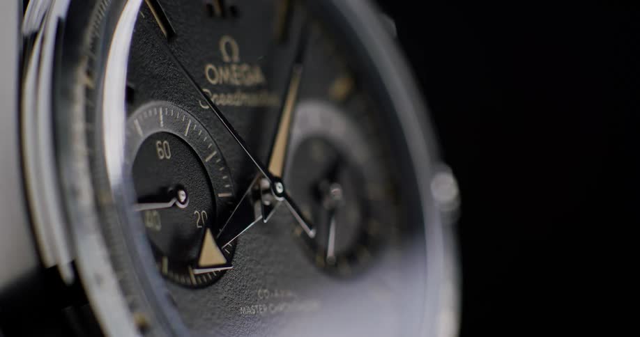 Many hands of an omega watch are turning