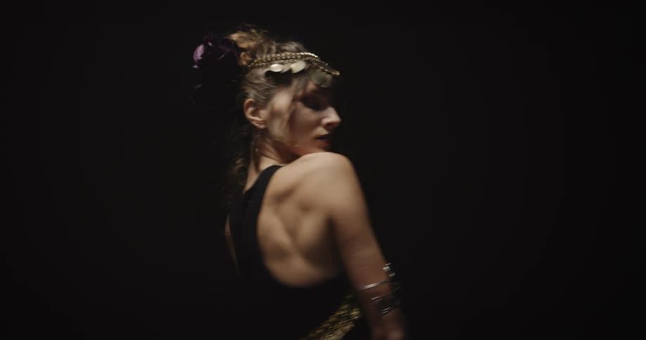 A woman is belly dancing