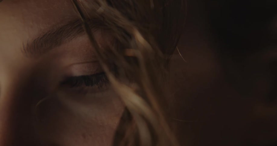 A woman blinks her eyes