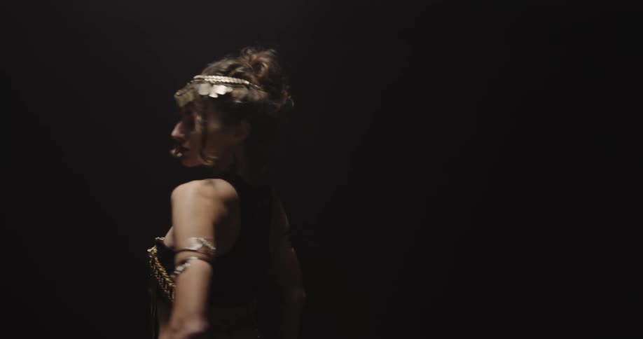 A woman is belly dancing