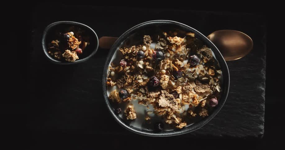 A bowl of cereal is on display on a table