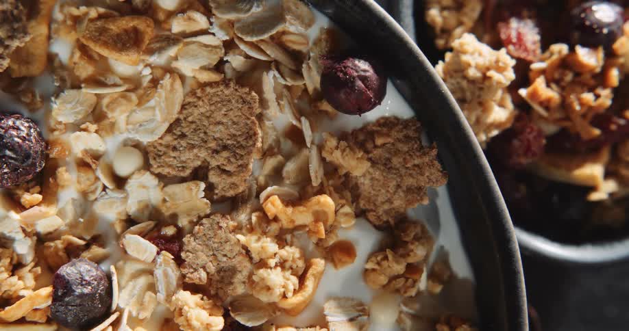 Slow motion view of breakfast cereal is displayed
