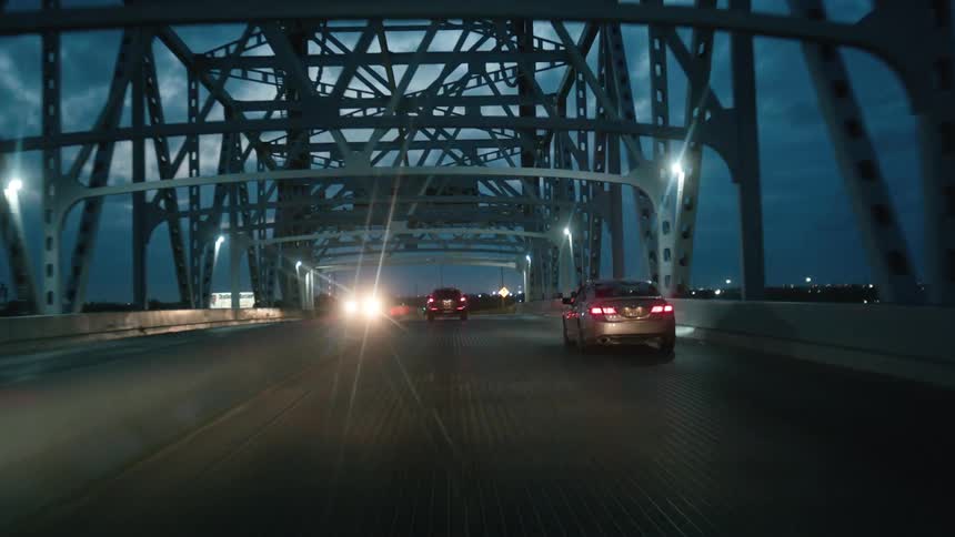 Driving across a bridge at night