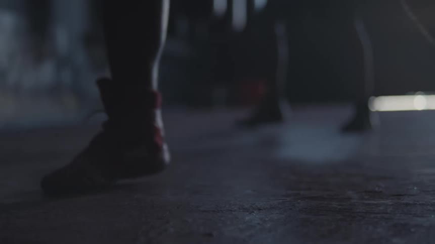 Close up of boxers footwork in boxing gym