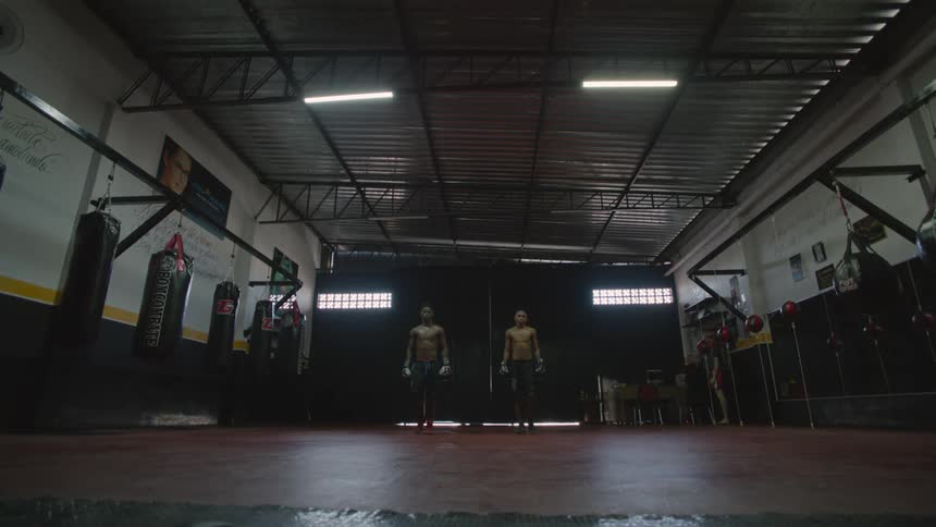 Two men are walking into the gym in the day time