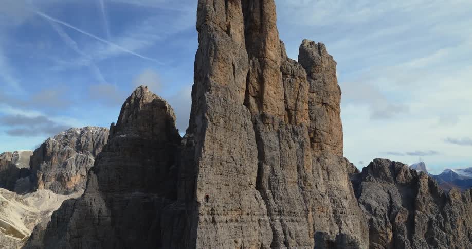 An aerial view of a steep rocky cliffside in the wilderness