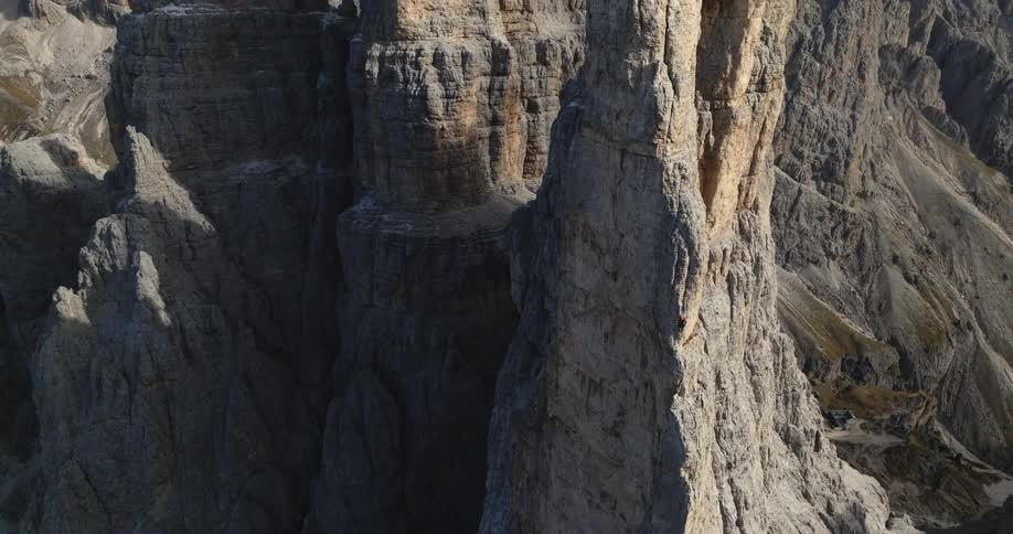 The view is of cliffs in the summer time and you can see landscape from the distance