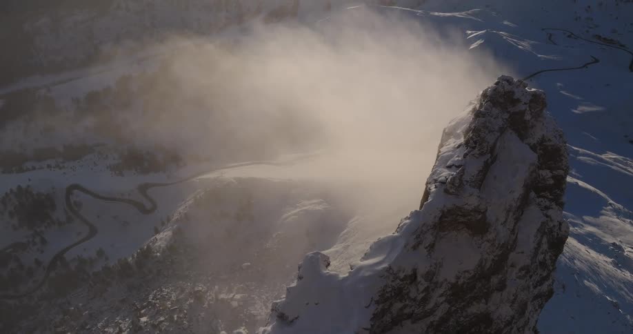 A thick blanket of snow covers a vast mountain range