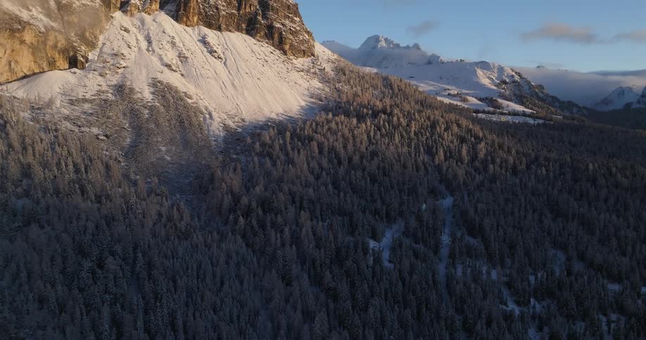 Aerial view of snow covered mountains is displayed