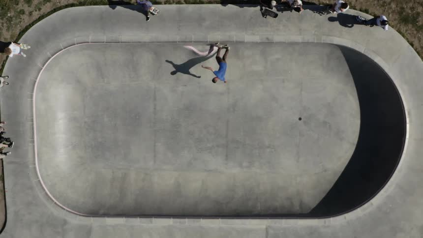 Group of young people practicing skateboarding on a sunny day