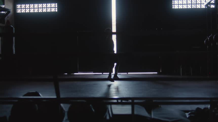 A person is exercising by himself indoors