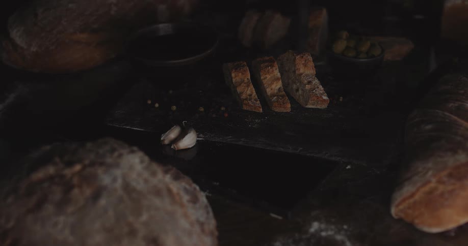 Loaves of bread are on a table for the display