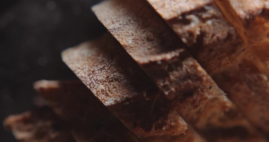 Several slices of thick bread is sitting on a surface