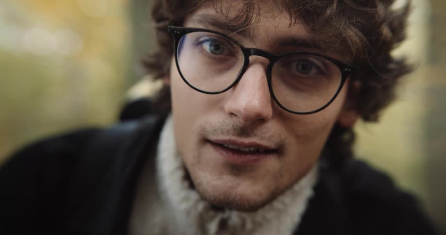 Close up view of a male smiling outdoors during spring