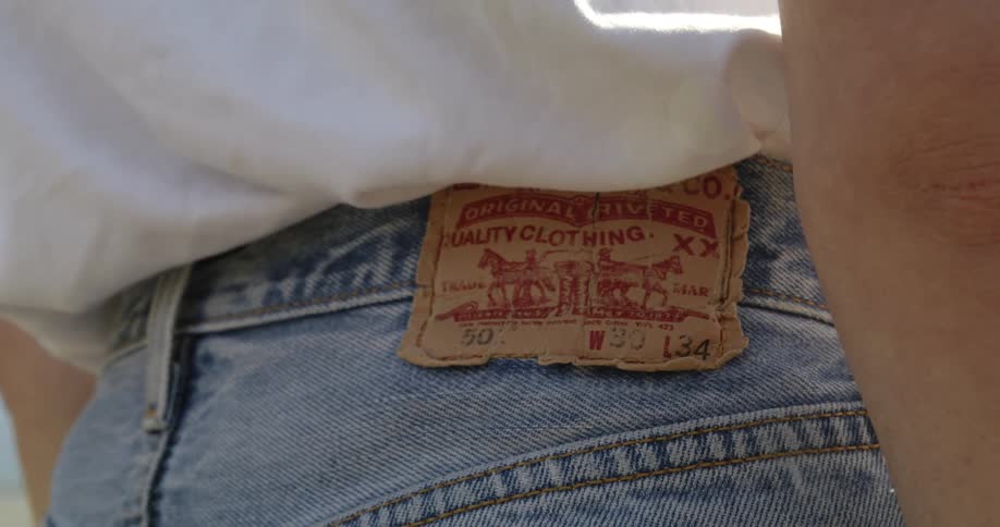 Close up of womans levis jeans with red tag
