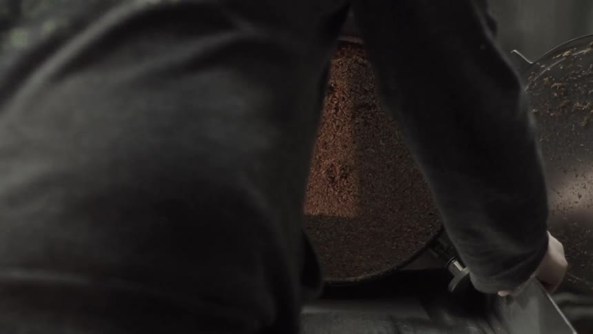 A man attaches a mettle piece to a machine
