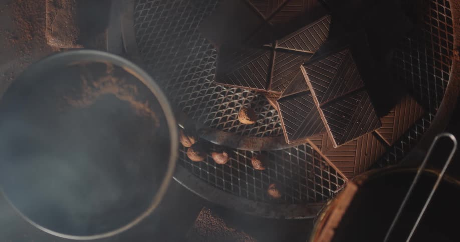 Dust settles over freshly made chocolate bars on a wire rack