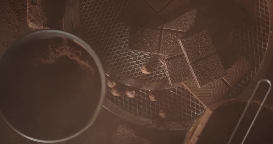 Close up of chocolate bars and a bowl of cocoa