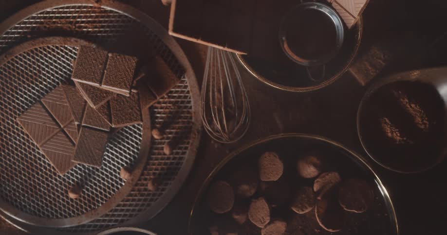 White smoke dissipates over bowls filled with chocolate tablets and bonbons
