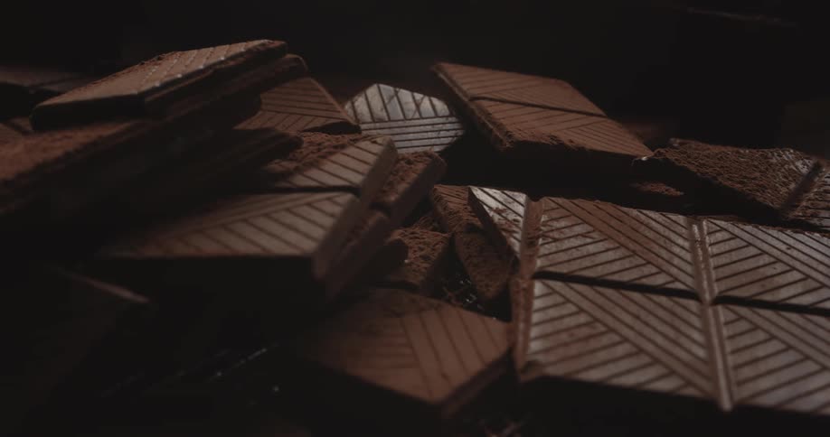 Close up of chocolate bars with cocoa powder