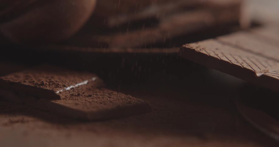 There is chocolate on the table with powder everywhere