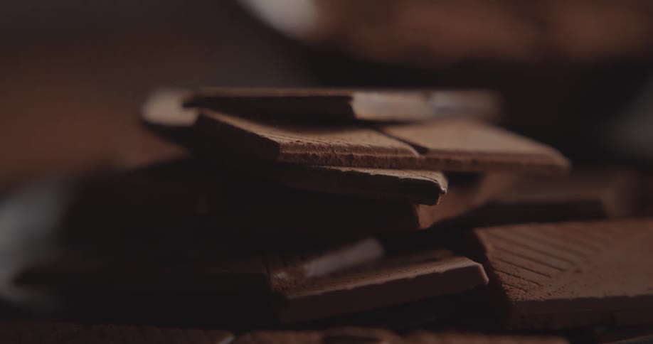 Thin chocolate bars are placed in a stack
